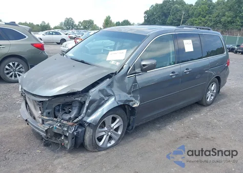 2010 Honda Odyssey Touring z USA, uszkodzony, nr VIN 5FNRL3H96AB053727